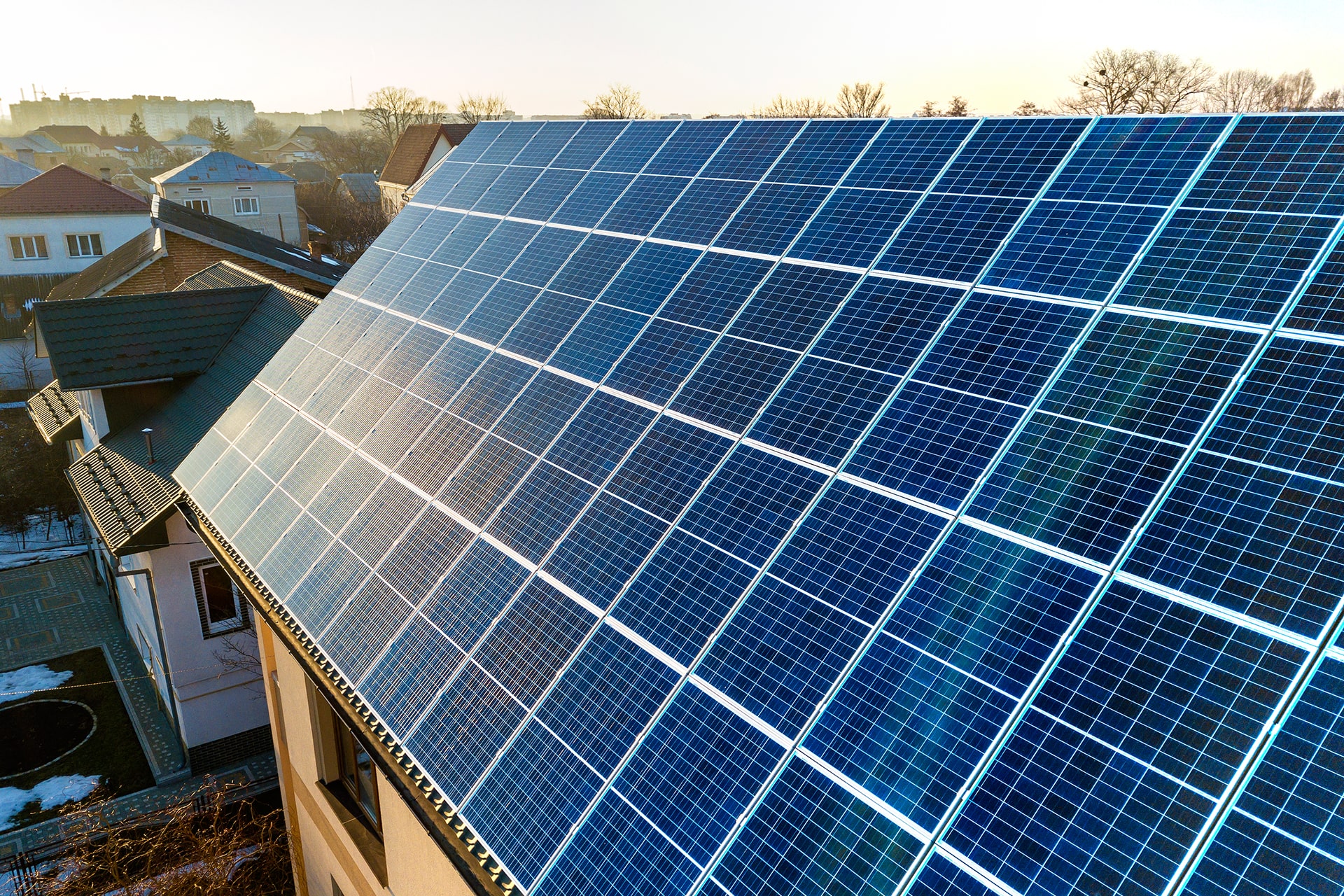 aerial-view-new-modern-two-story-house-cottage-with-blue-shiny-solar-photo-voltaic-panels-system-roof-renewable-ecological-green-energy-production-concept